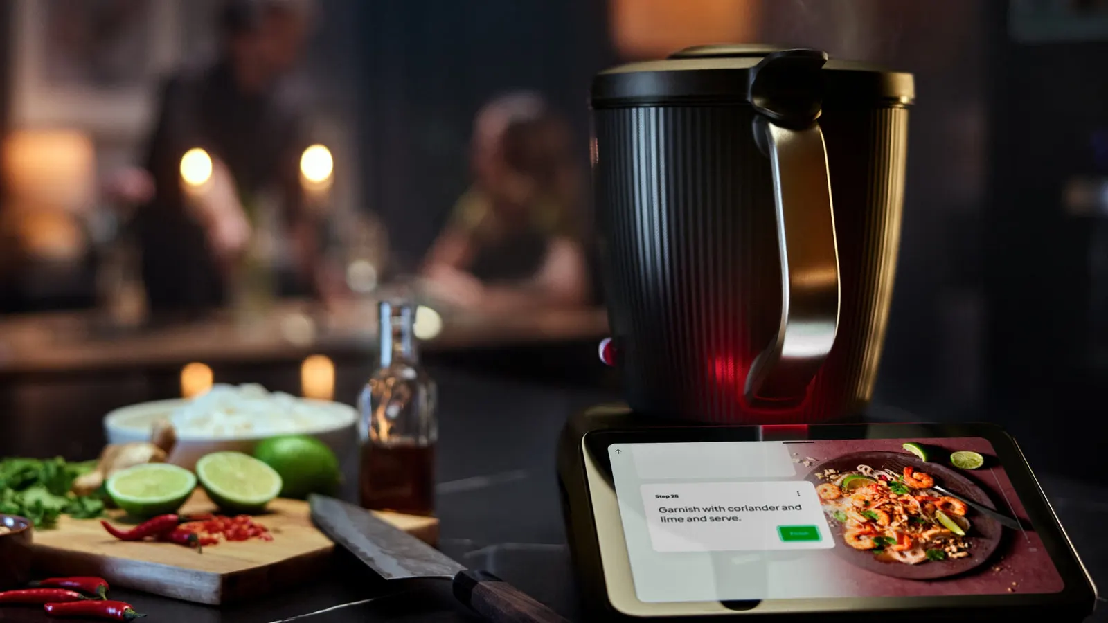 Thermomix TM7 beside a freshly cooked dinner, a home-cooked alternative to meal kits